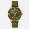 Green watch with rose gold accents on a white background