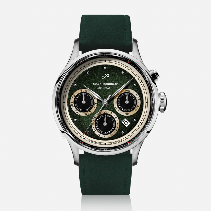 Green wristwatch with a detailed face on a white background